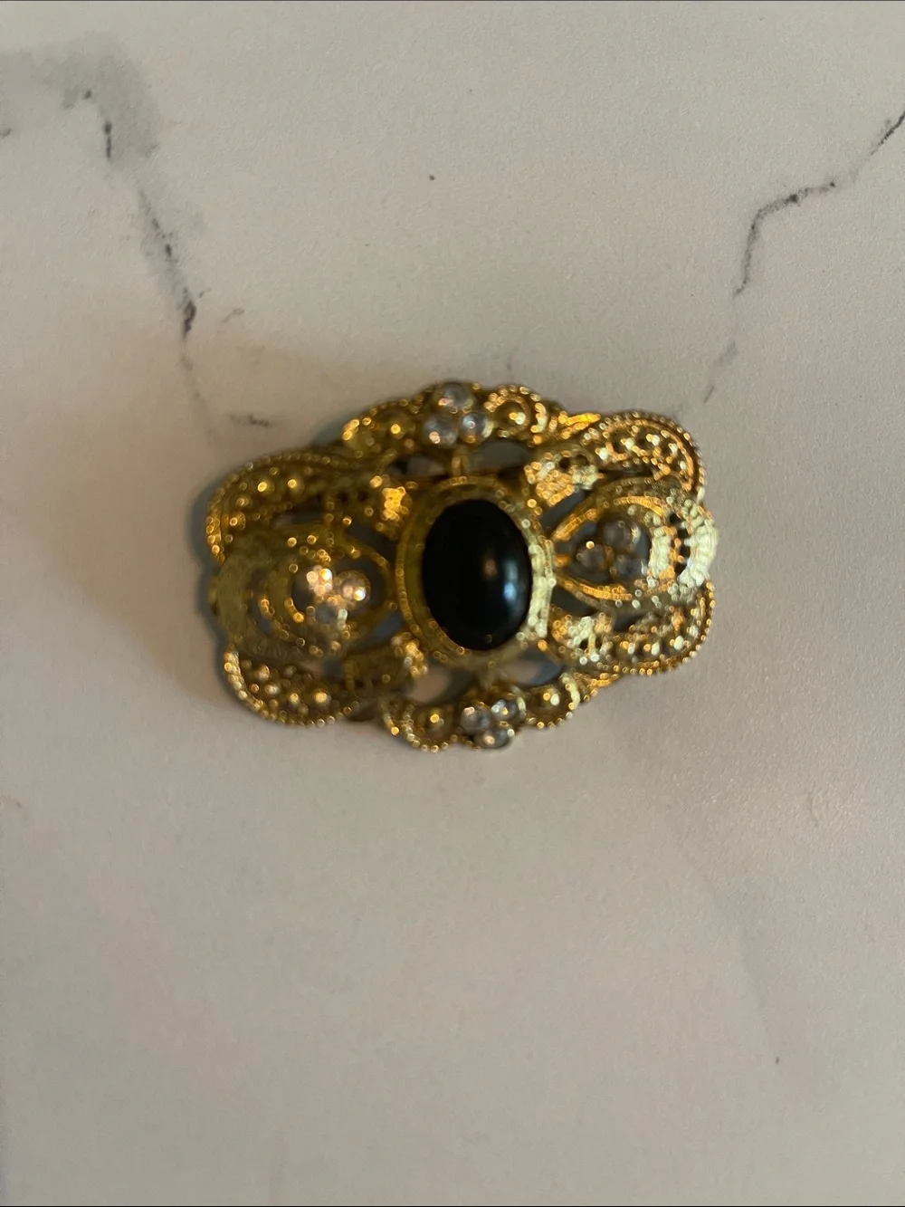 Gold Filigree Brooch with Black Cabochon